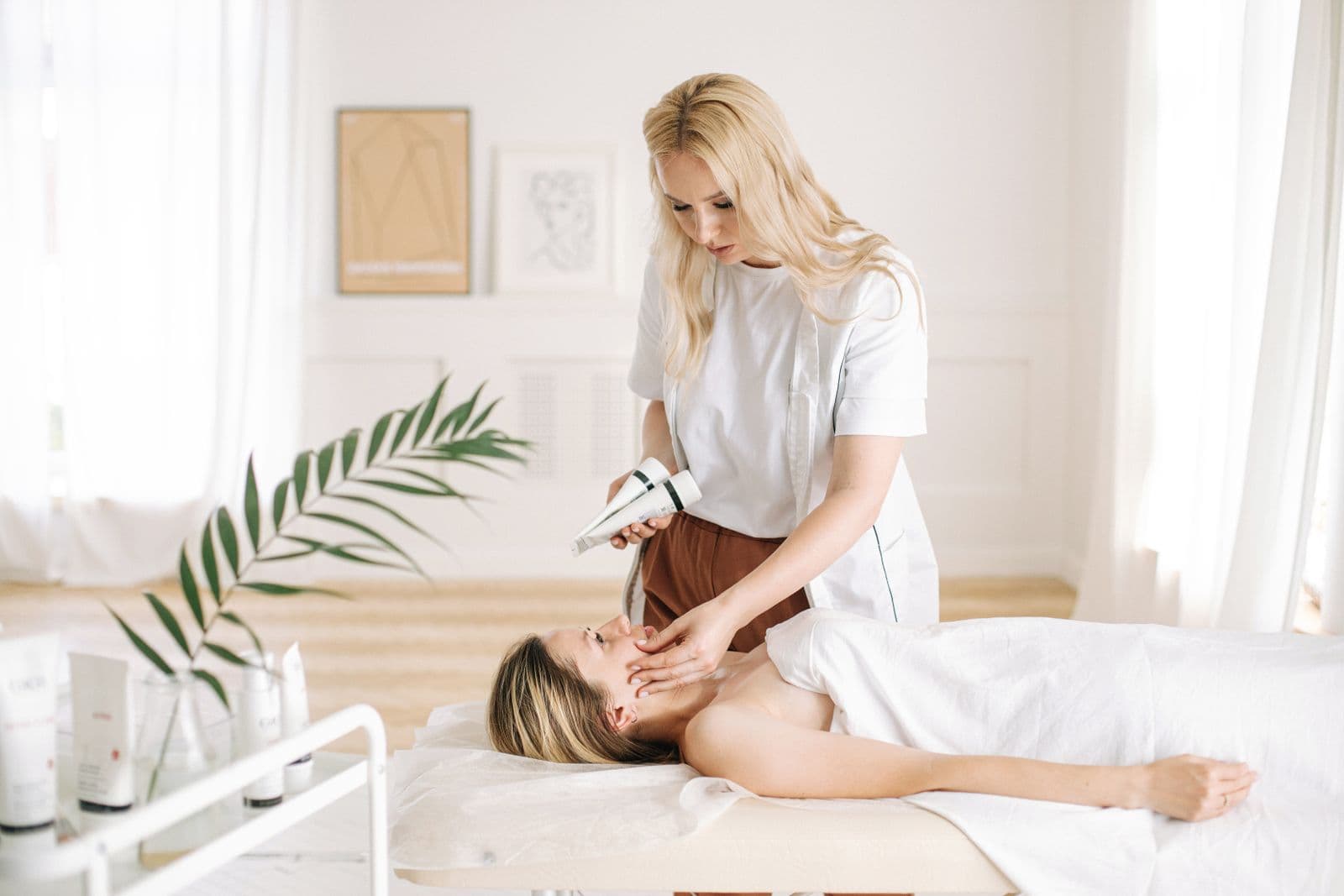Esthetician performing a professional facial treatment for September skin renewal