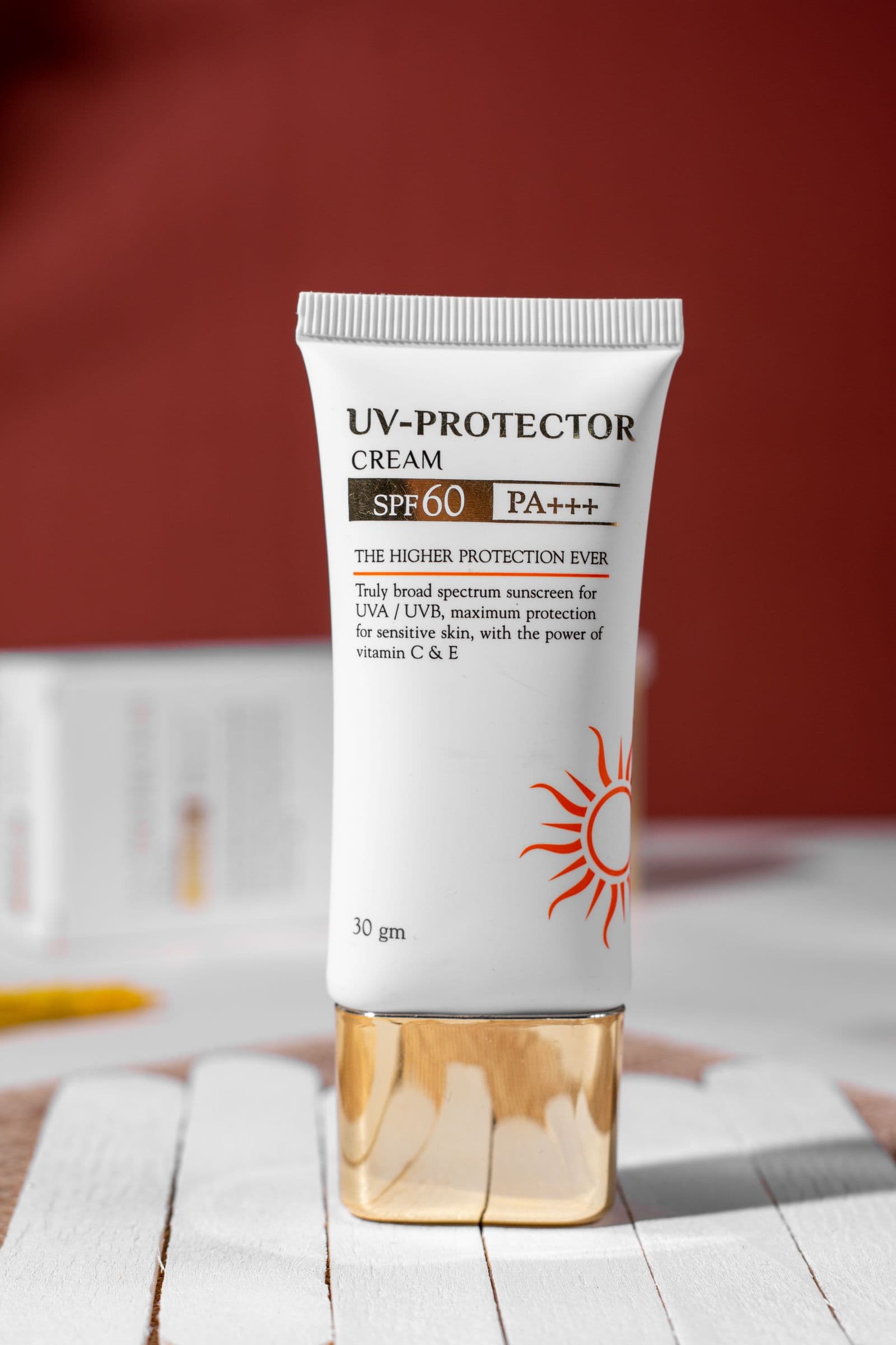 Broad-spectrum SPF sunscreen cream tube labelled UV Protector SPF 60 PA+++ — daily UV radiation protection